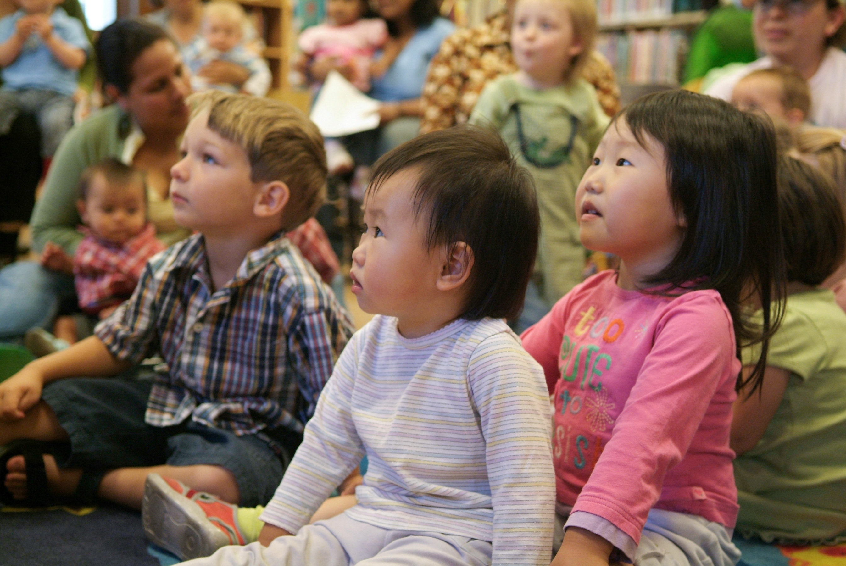 Young children watching storytime presenter