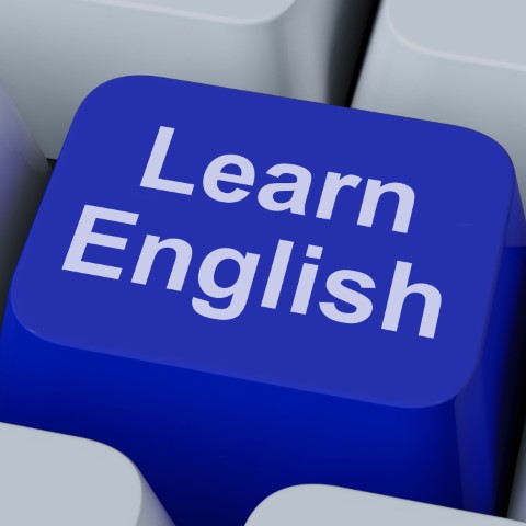 A blue computer keyboard button that says Learn English