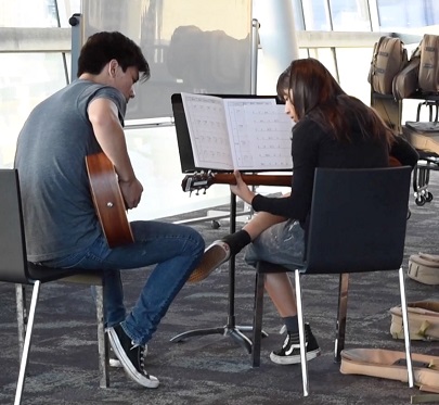 Guitar instructor and student