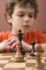 Boy plays chess