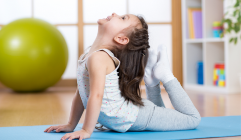 Child in a yoga pose.