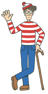 Where's Waldo character: man dressed up in blue jeans & red & white shirt & beanie 