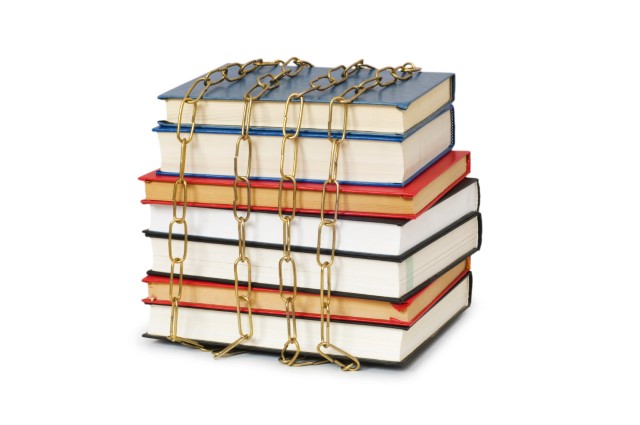 Photo of stack of books bound by chains.