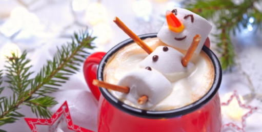 Marshmallow snowman in a hot chocolate cup.