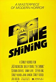 Yellow background with the words "The Shining" and a man's eyes in the T.