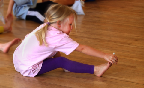 Young girl stretching