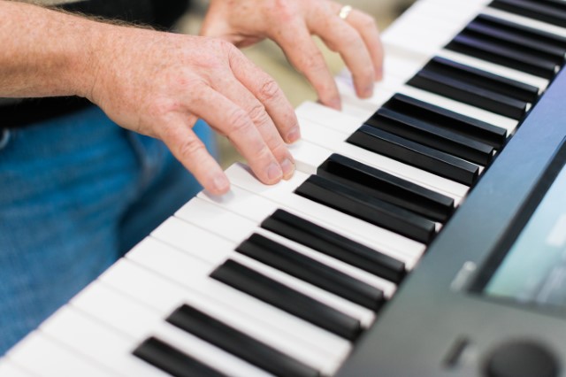 hands playing a keyboard