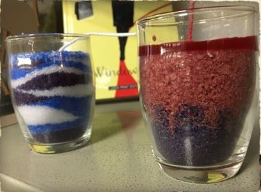 Granulated wax candles in red and blue hues.