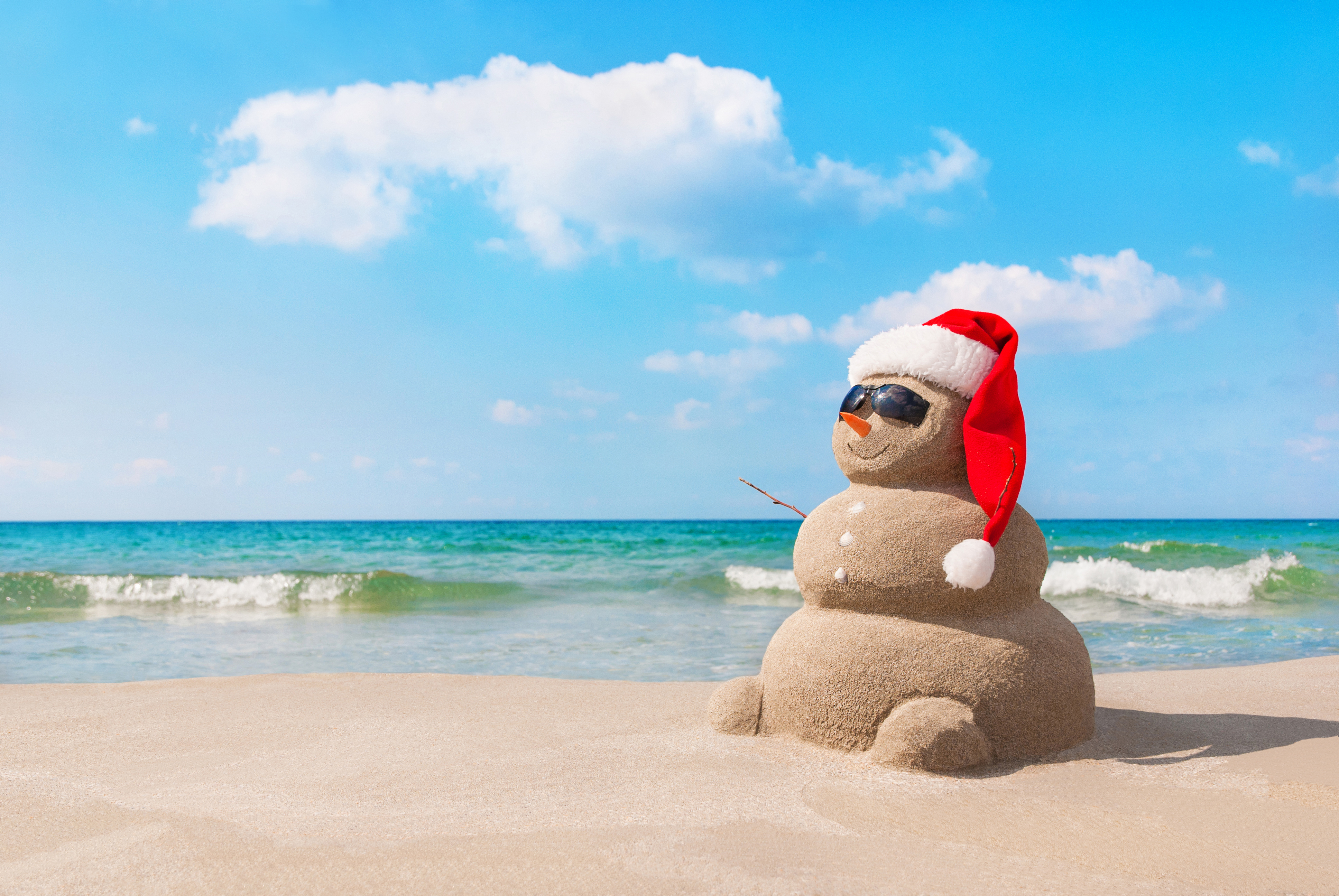 Sand Snowman on a sunny beach