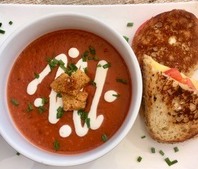 bowl of tomato soup with bread
