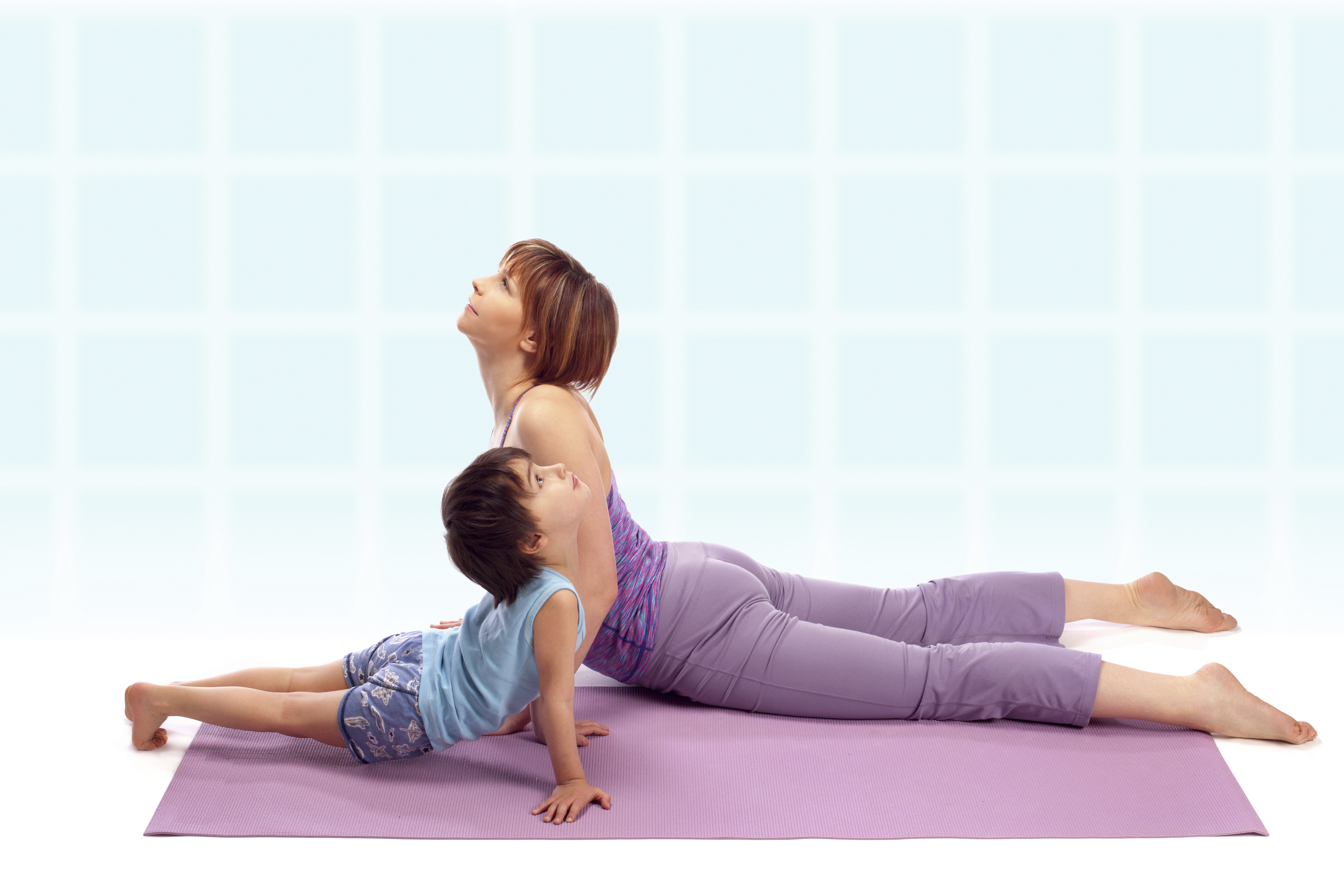 Woman and son doing yoga