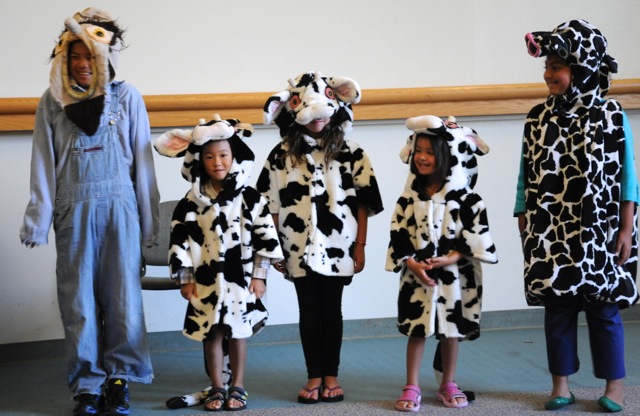 Children in cow costumes