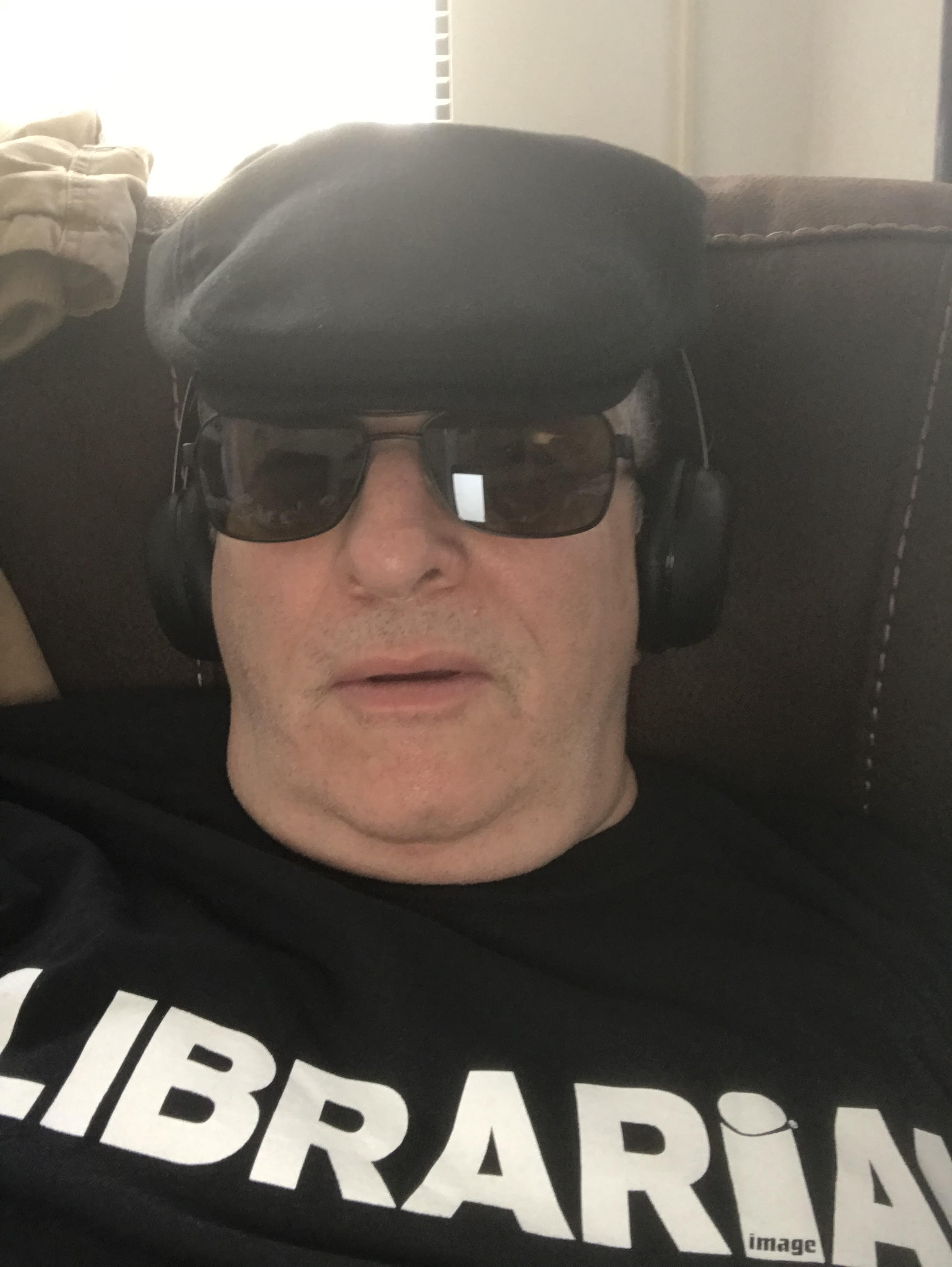 Photo of Mark Harryman, wearing a shirt with the word "Librarian"