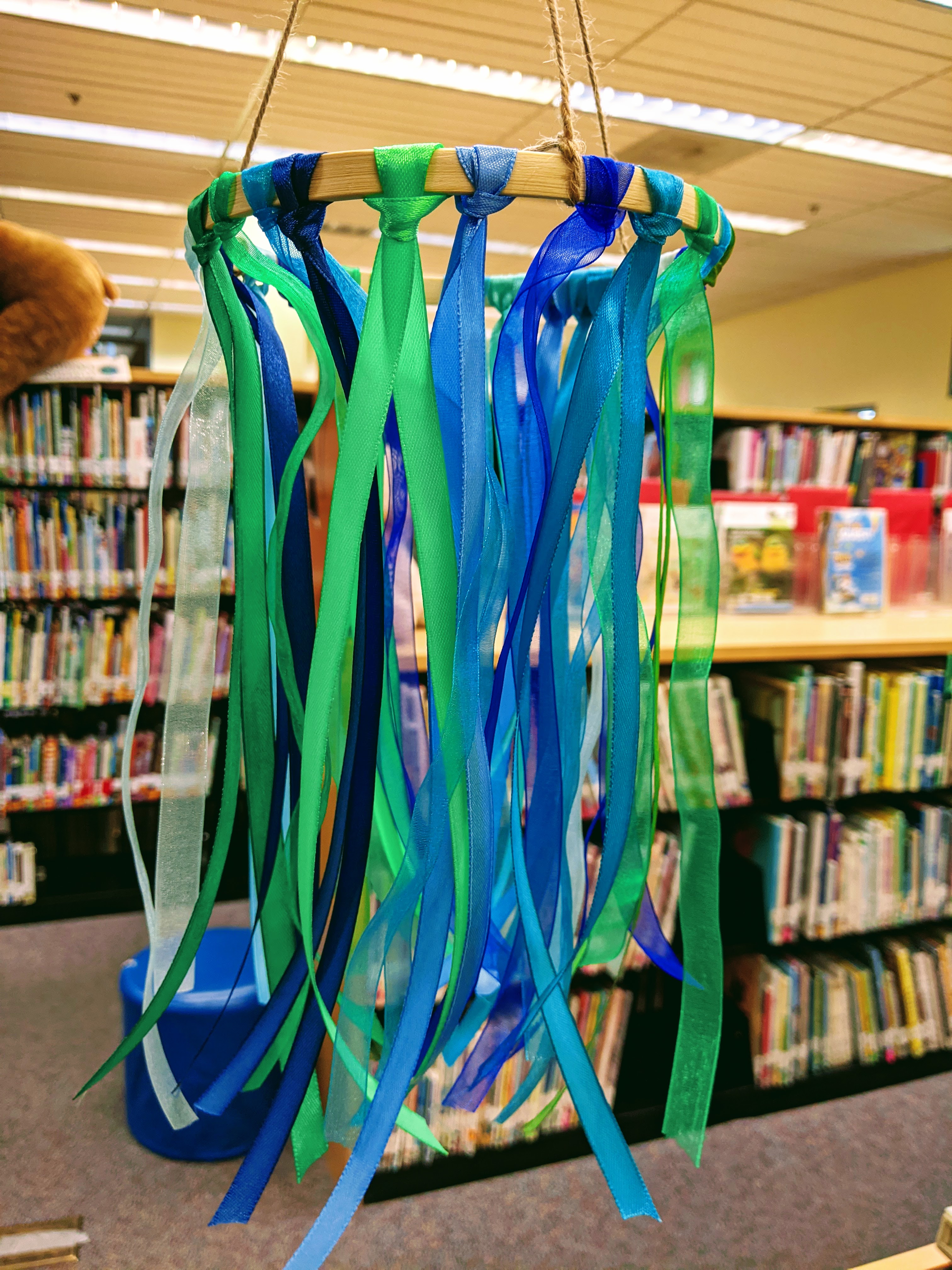 Mobile made of ribbon in various shades of blue and green