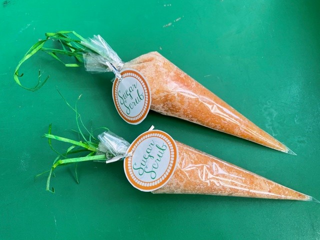 Plastic bags filled with orange sugar, resembling carrots