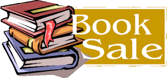 Stack of books next to text reading "Book Sale"