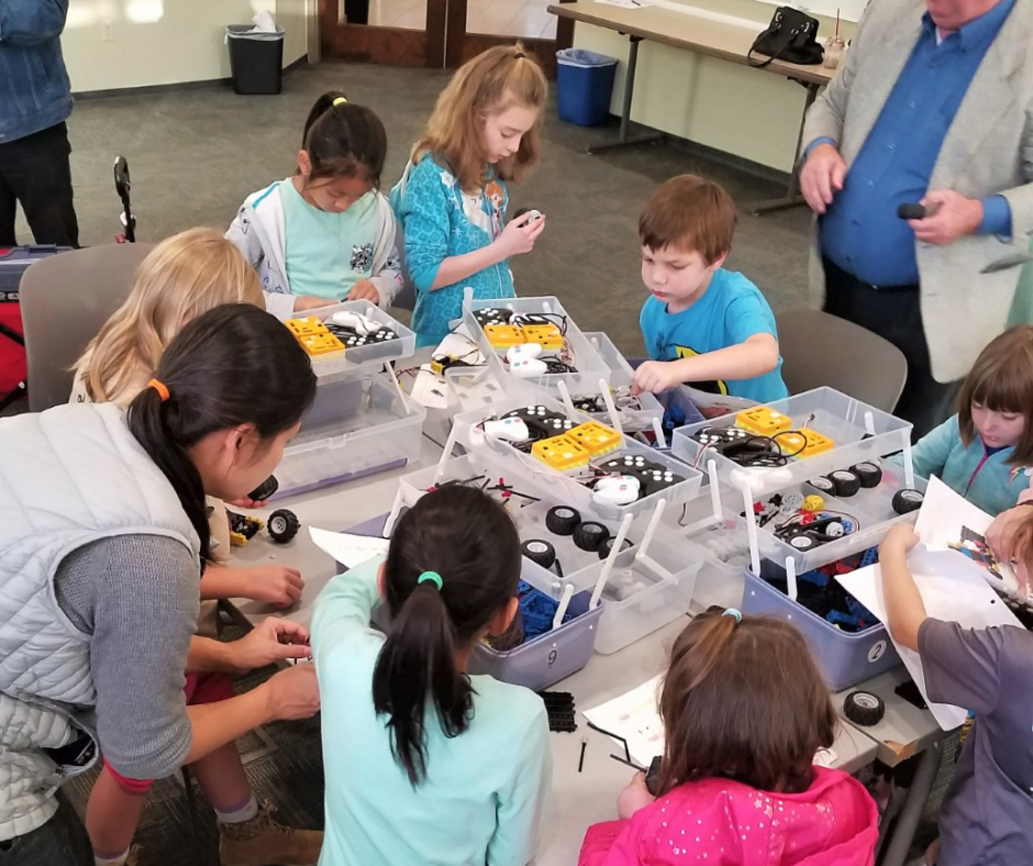 Children building robots