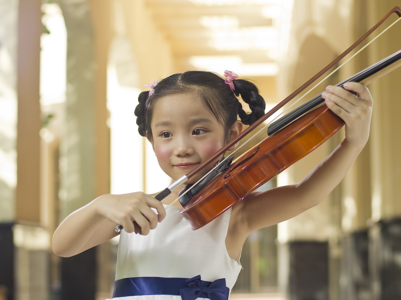 Child using a violin