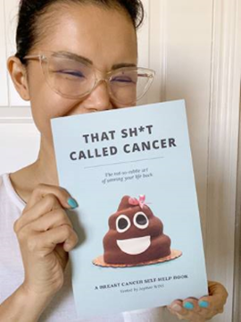 Author Jaymee holding "That Sh*t Called Cancer" book