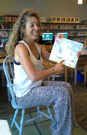 Picture of Ms Teri reading a book.