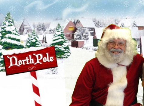 Man dressed as Santa. Winter background scene with a house and a North Pole sign post.