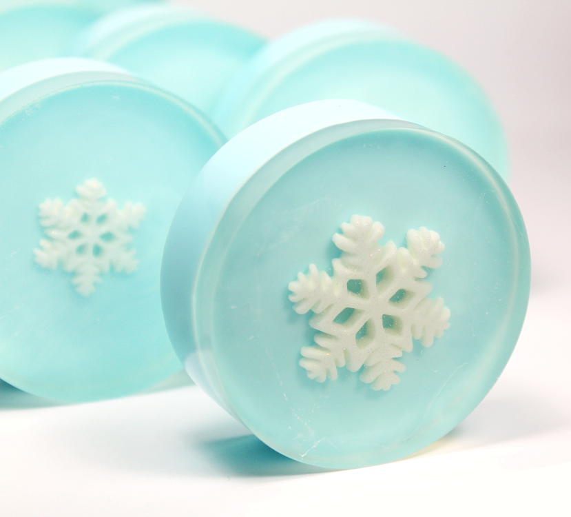 Photo of light blue round soap with white snowflake design