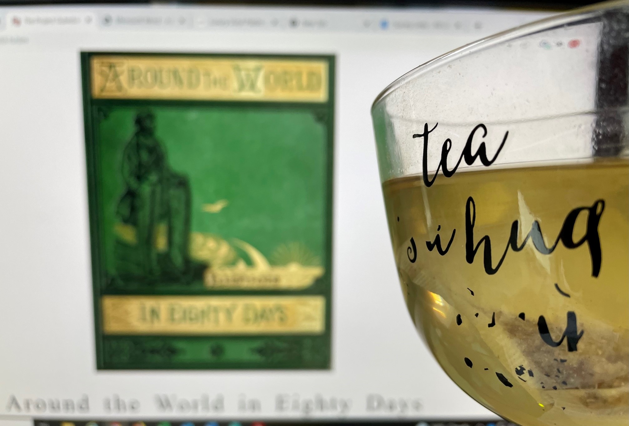Cover of "Around the World in Eighty Days" with a cup of tea