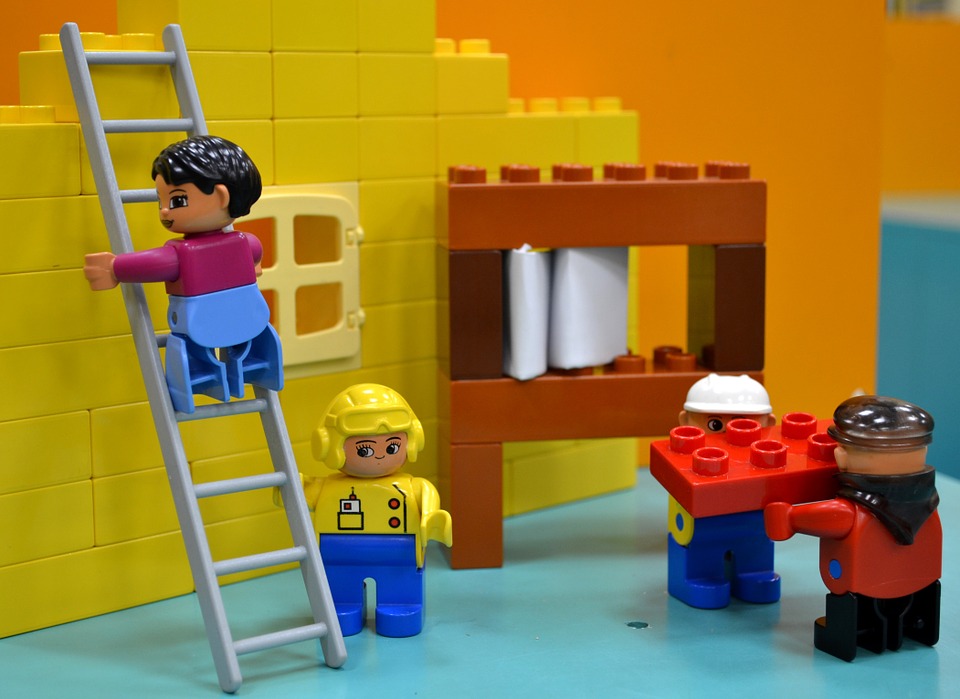 Lego people building wall