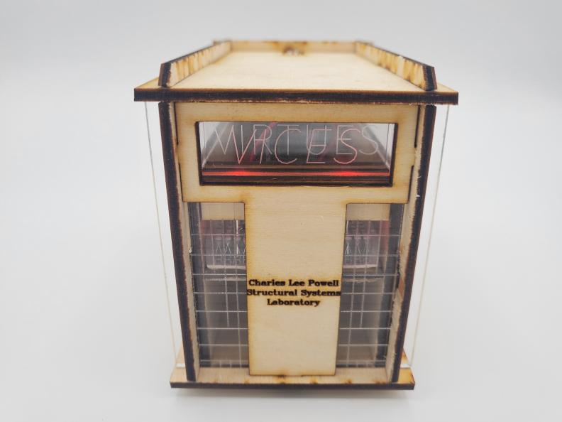 lasercut wood box with small acrylic panels etched with the words "vices" and "virtues"
