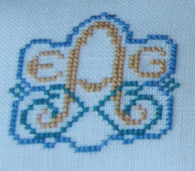 Cross Stitched EGA Logo in blue and gold