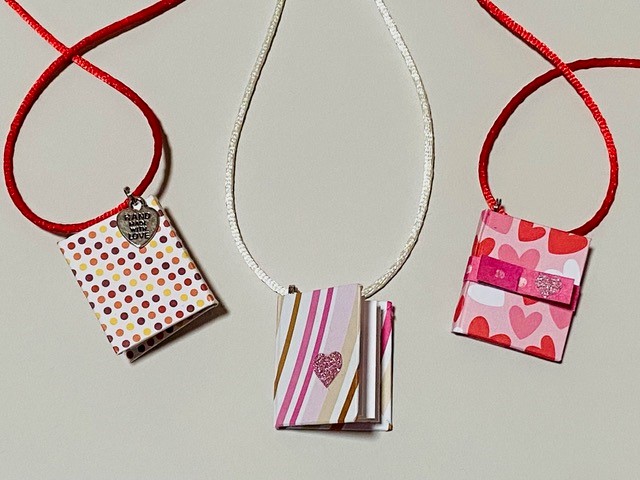 3 Necklaces where the pendants are miniature books