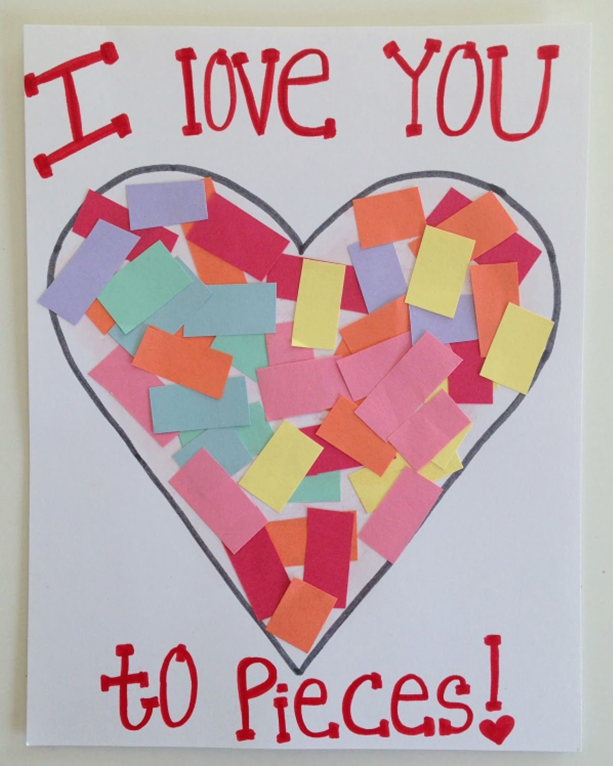 Card with a heart filled in with small pieces of colored paper