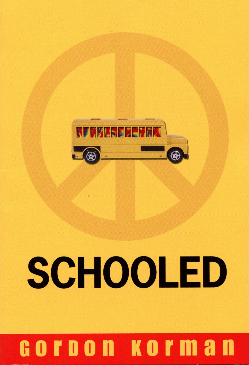 cover of the book Schooled shows a school bus superimposed over a peace sign