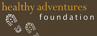 Logo with the words healthy adventures foundation and prints that appear to be from hiking boots