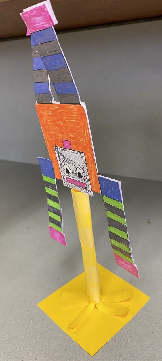 Paper robot balancing on its head