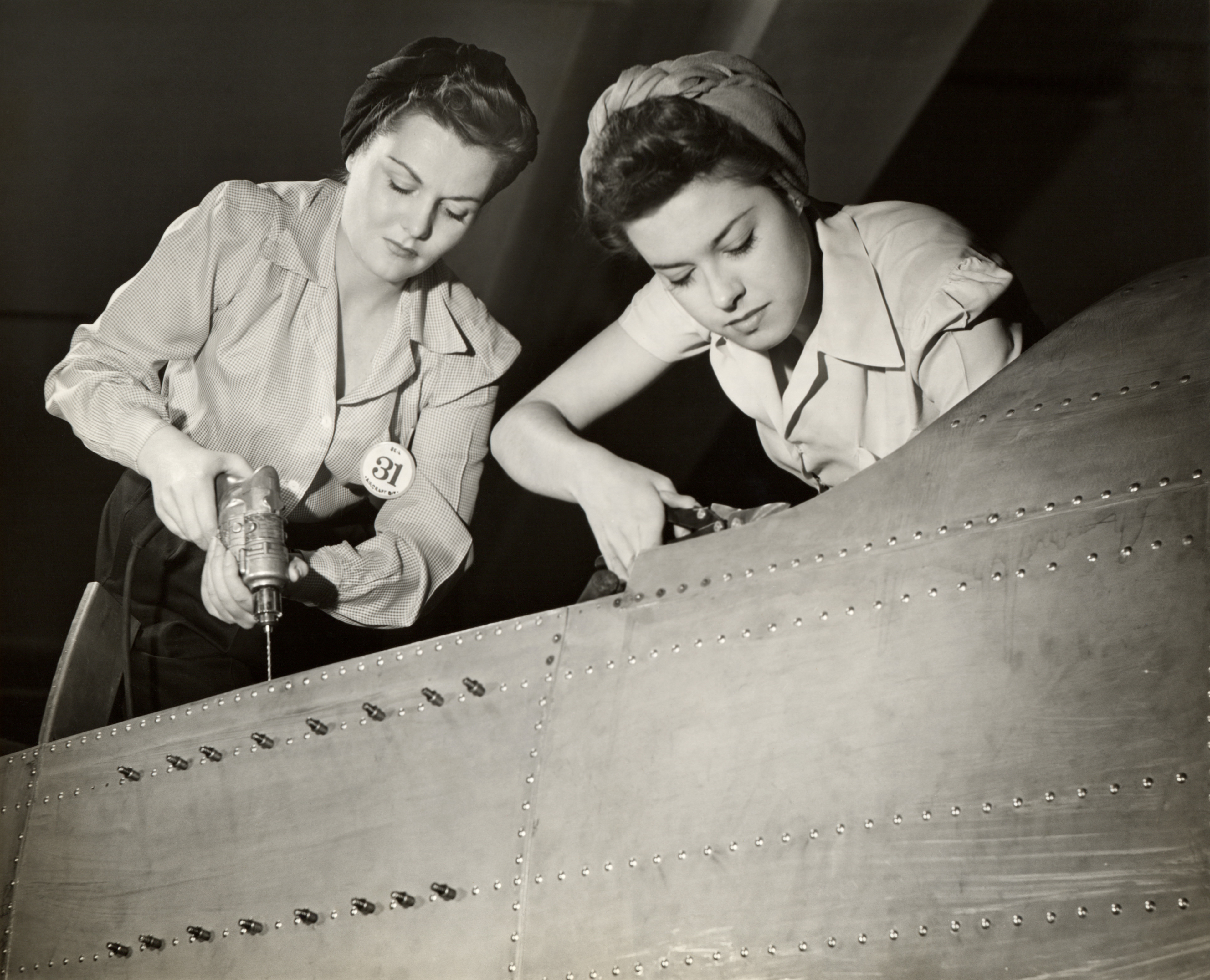Women working on an airplane during WWII.