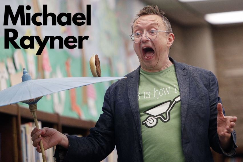 Michael Rayner rolling a hamburger on an umbrella