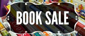 Black placque with BOOK SALE in white letters
