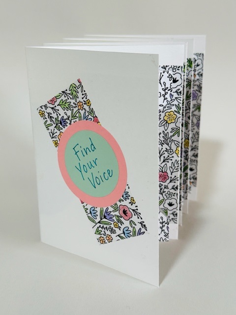 A handmade book with the words Find Your Voice on the cover