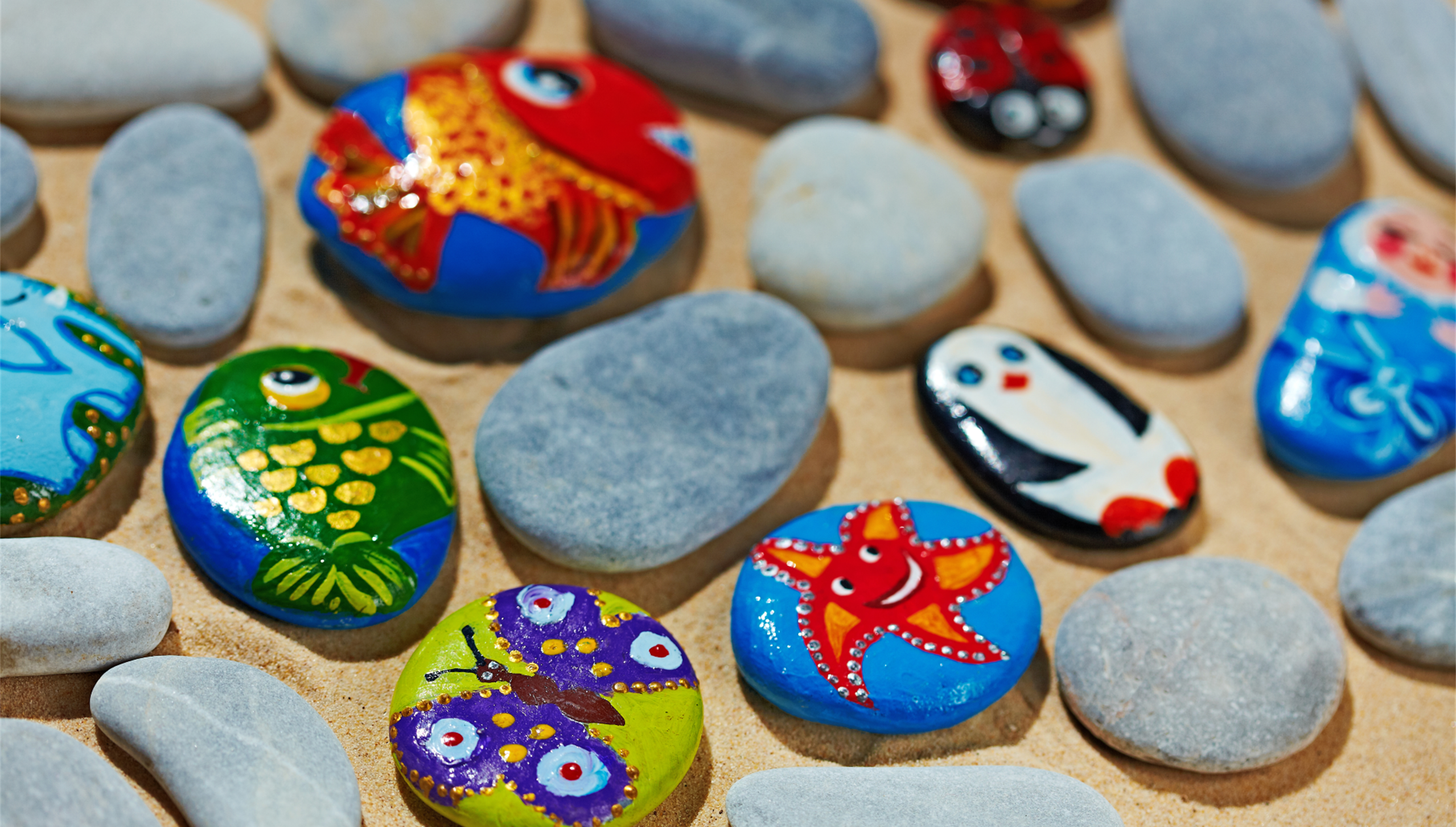 River rocks with brightly painted decorations