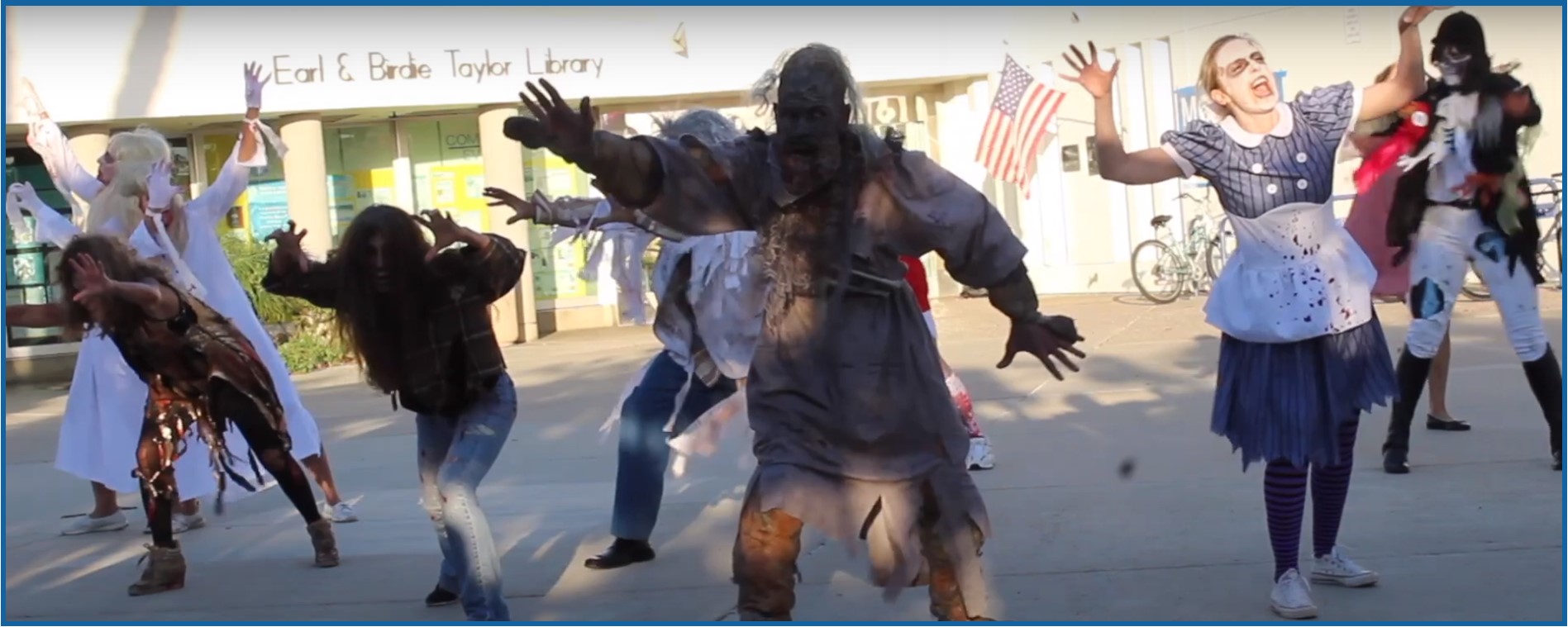 Zombies dancing in front of the Pacific Beach Library