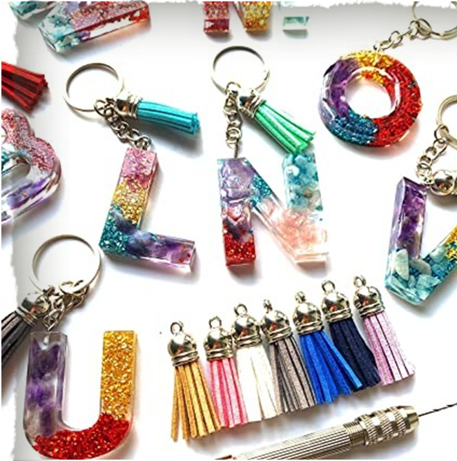 photo of several colorful initial resin keychains and tassels