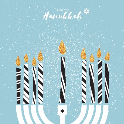 White menora with eight black and white striped candles and yellow flame