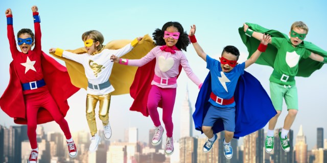 Children wearing super hero masks and capes