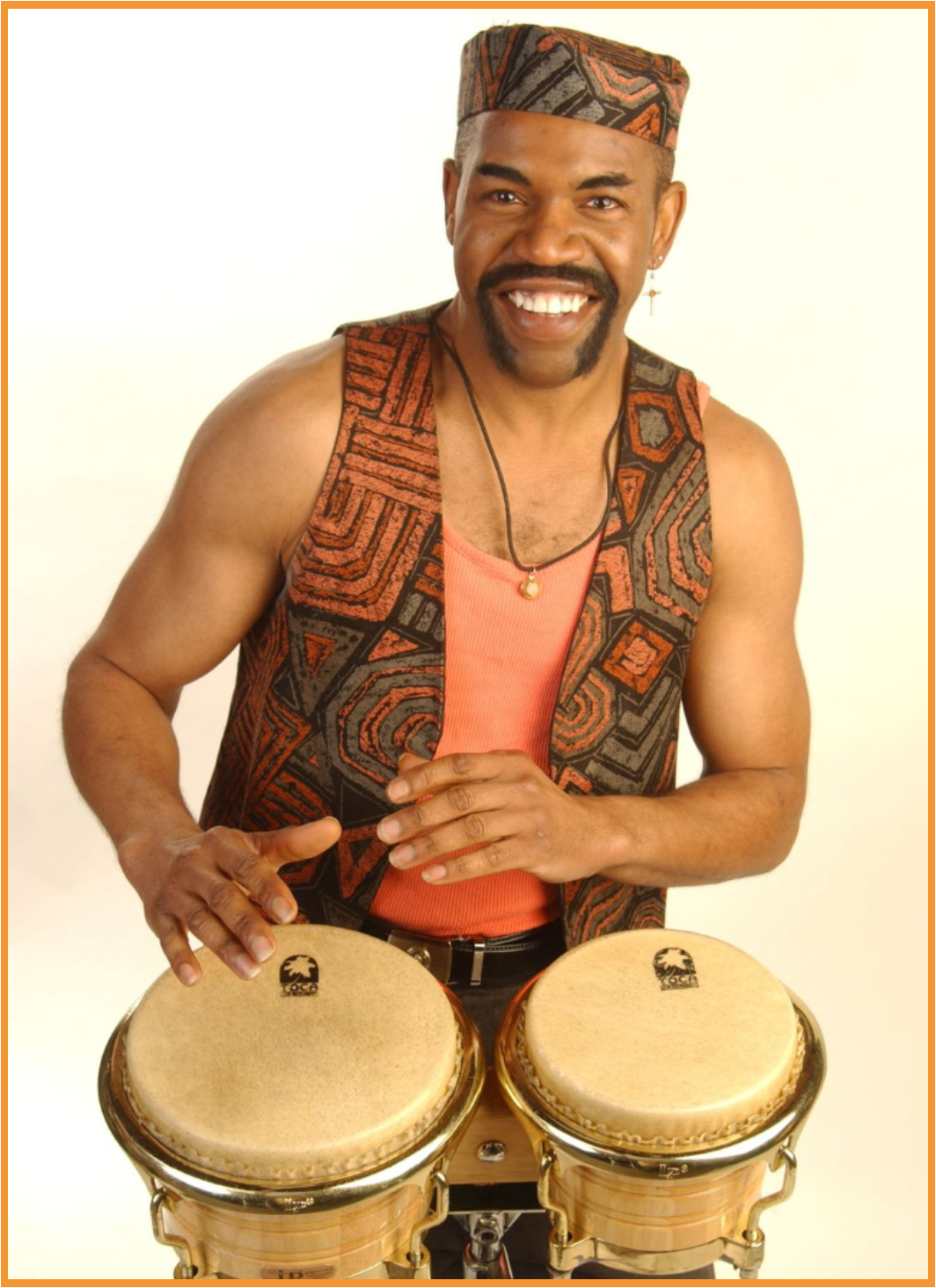 Smiling man with vest and hat playing drums