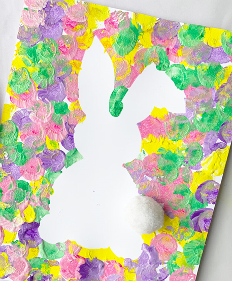 pink, purple, green circles around outline of white bunny