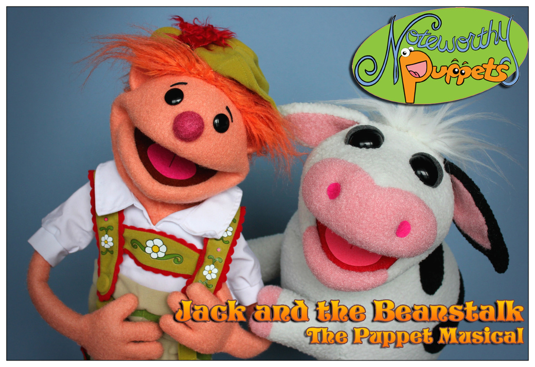 A boy puppet with red hair next to a cow puppet, who are both singing