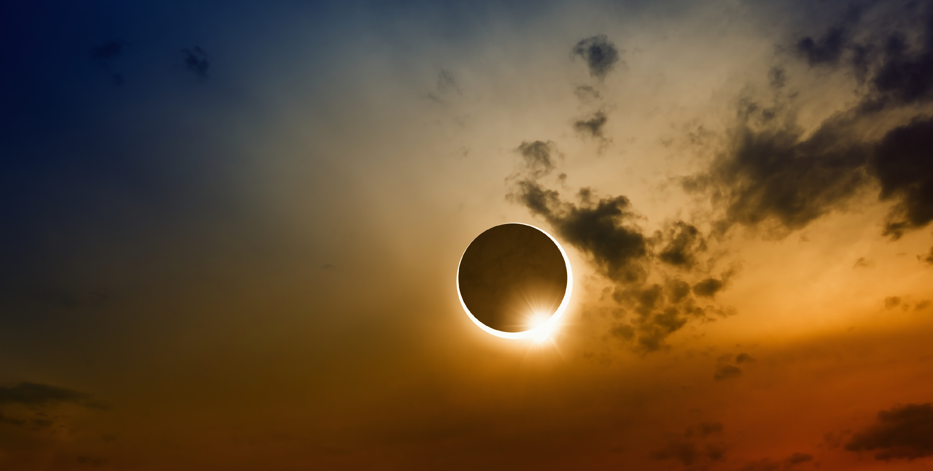 The sun blocked by the moon in a solar eclipse. 