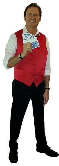 Magician in red vest and black pants, holding a fan of playing cards.
