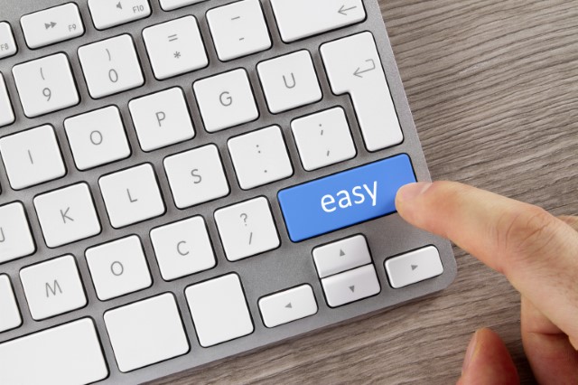Computer keyboard with a finger pointing at a key labeled "easy"